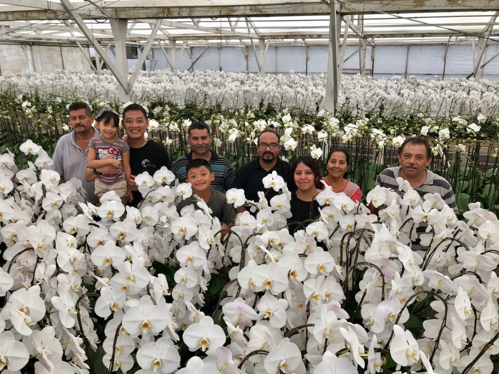 Photo with Endeavour and staff on the upstairs portion of his farming operation, South Coast Orchids. 