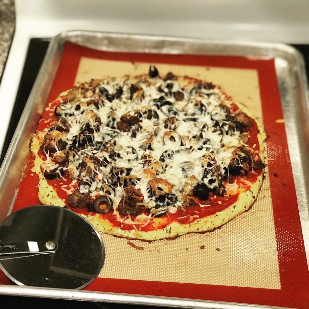 Homemade cauliflower crusted pizza, fresh out of the oven. How to Make Pizza Sauce with Fresh Tomatoes - a class by Daily Harvest Express.
