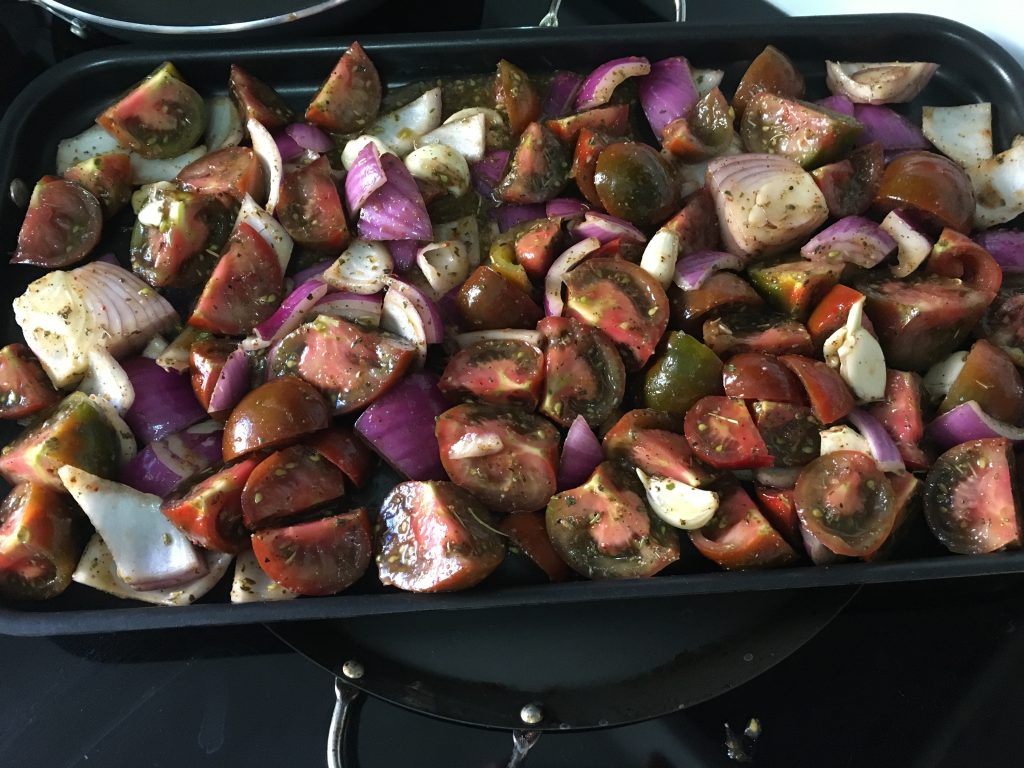 Fresh tomatoes, onions, and garlic, tossed and coated with herbs and waiting to roast in the oven! Class: How to Make Pizza Sauce with Fresh Tomatoes