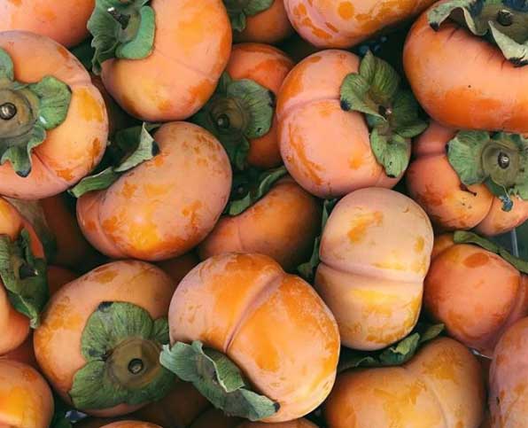 What's round, orange, and tastes like fall? Nope, not pumpkin spice latte. The correct answer is persimmons. 
